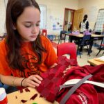 pei.-elementary-students-craft-their-own-small-dresses-while-learning-for-red-dress-day-ceremony