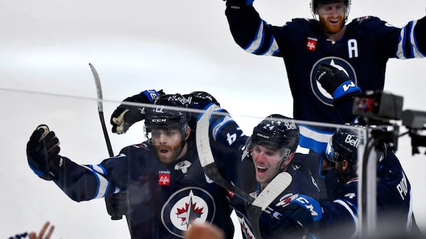 jets-captain-lowry-scores-game-7-winning-goal-in-double-ot-against-blues