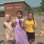 students-at-sherwood-elementary-school-gleefully-leaping-into-summer-early