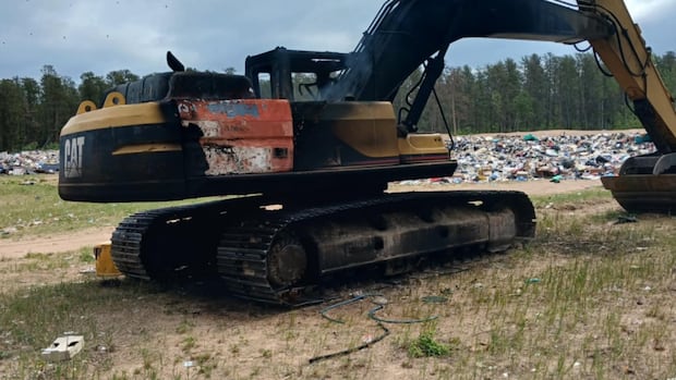 excavator-shot-and-set-on-fire-in-village-of-pinehouse,-sask.