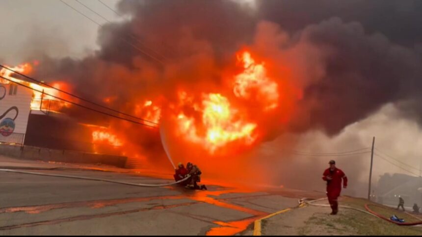 manitoba-premier-wab-kinew-tours-wildfire-zones-by-air-as-21,000-remain-out-of-homes