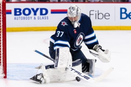 jets-goaltender-hellebuyck-cements-spectacular-campaign-with-hart,-vezina-awards