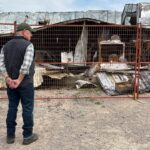 owner-of-robertson-trading-surveys-wildfire-damage-that-burned-historic-building-to-the-ground