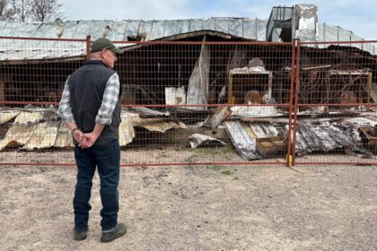 owner-of-robertson-trading-surveys-wildfire-damage-that-burned-historic-building-to-the-ground