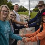 americans,-canadians-meet-at-international-peace-garden-for-handshake-across-the-border