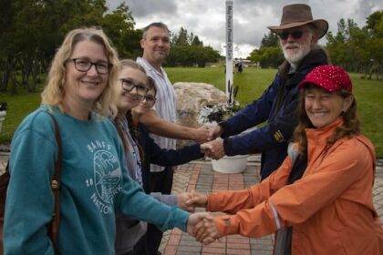 americans,-canadians-meet-at-international-peace-garden-for-handshake-across-the-border