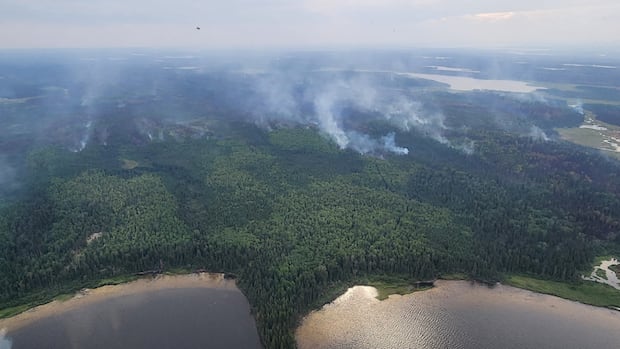 wildfire-risk-downgraded-in-manitoba-as-rain,-residents-return-to-northern-communities