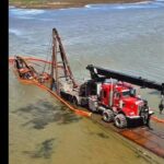 excavator-that-fell-through-ice-and-was-stranded-in-quill-lakes-for-over-a-decade-finally-pulled-out