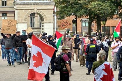tennis-protestors-raise-racket-again-saturday,-drive-anti-immigration-demonstrators-away