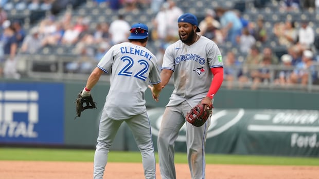 blue-jays-secure-playoff-spot-with-8-5-win-against-royals