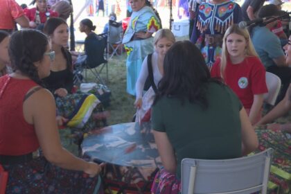 bringing-girls-to-the-drum-at-the-bilijk-powwow