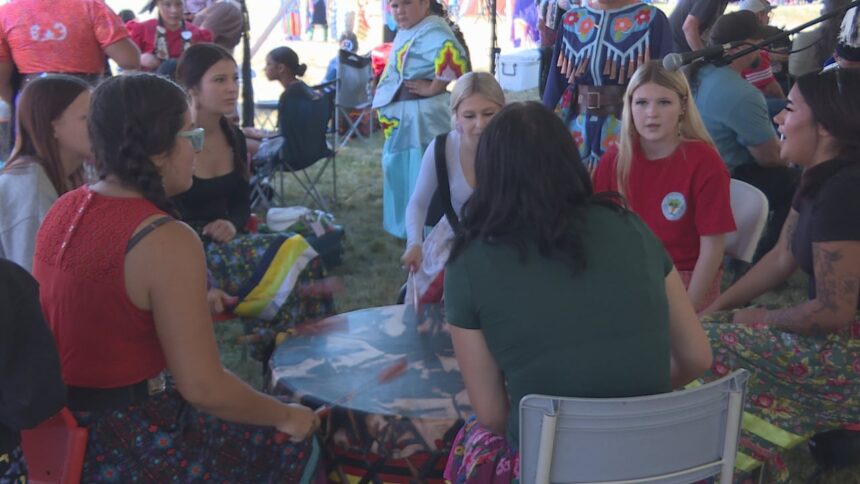 bringing-girls-to-the-drum-at-the-bilijk-powwow