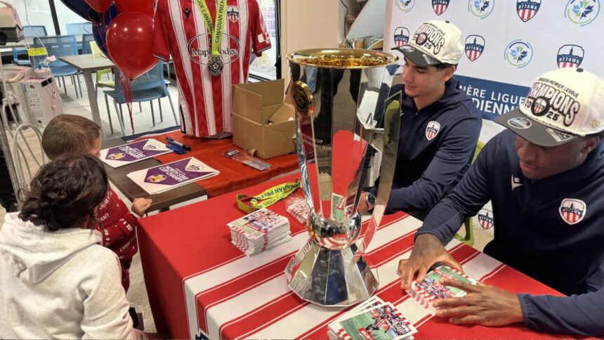 atletico-ottawa-players-bring-north-star-cup-to-cheo