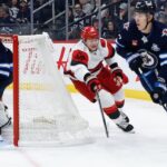 jets-goalie-comrie-‘rock-solid’-despite-4-3-loss-to-hurricanes,-coach-says