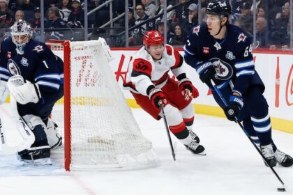 jets-goalie-comrie-‘rock-solid’-despite-4-3-loss-to-hurricanes,-coach-says