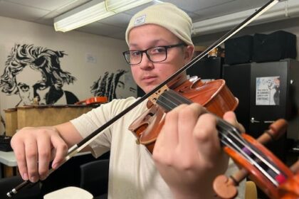 mi’kmaw-teen-tuning-up-viola-for-performance-at-carnegie-hall