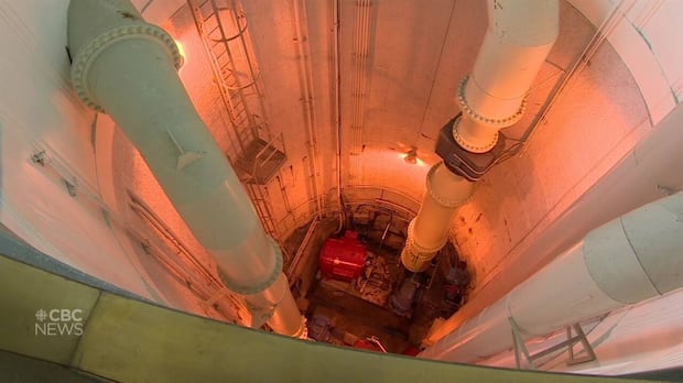 in-winnipeg,-a-distant-light-flickers-at-the-end-of-a-sewage-treatment-tunnel